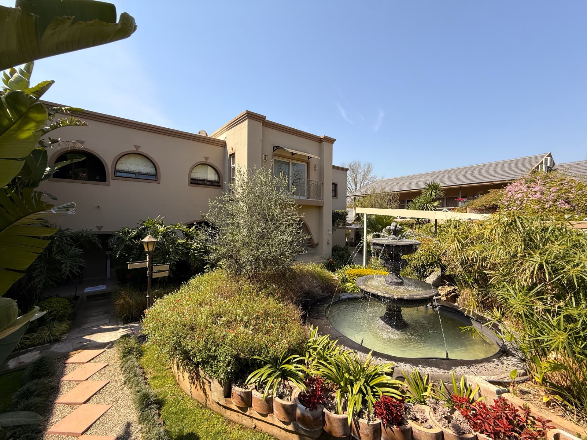 The Dunton courtyard fountain and surrounding garden seen from a different angle