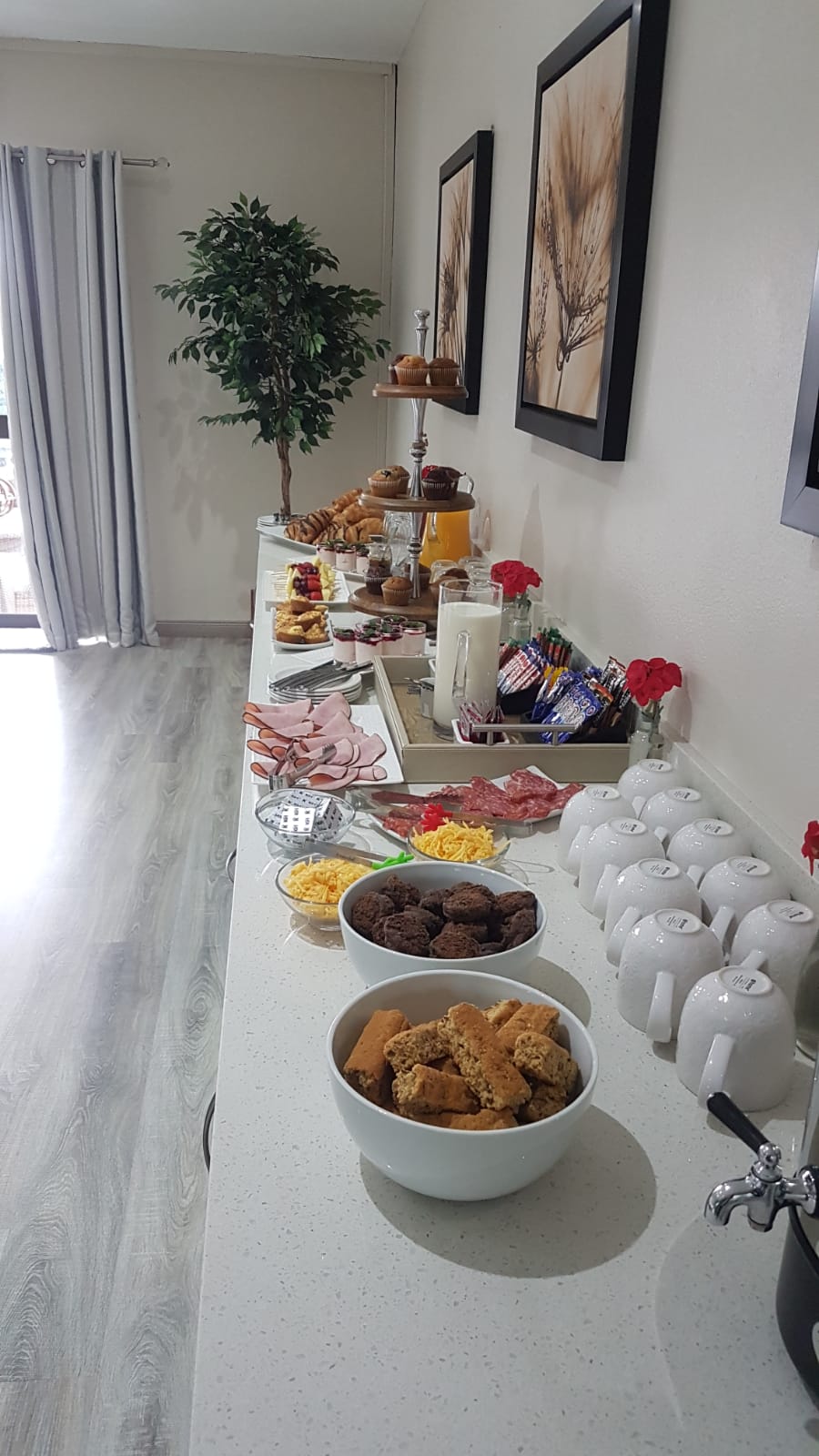 Conference catering counter with cold meats, cheeses, muffins, milk and coffee service at Dunton Guest House